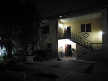 Garden Inn Hotel Front - Evening/Night